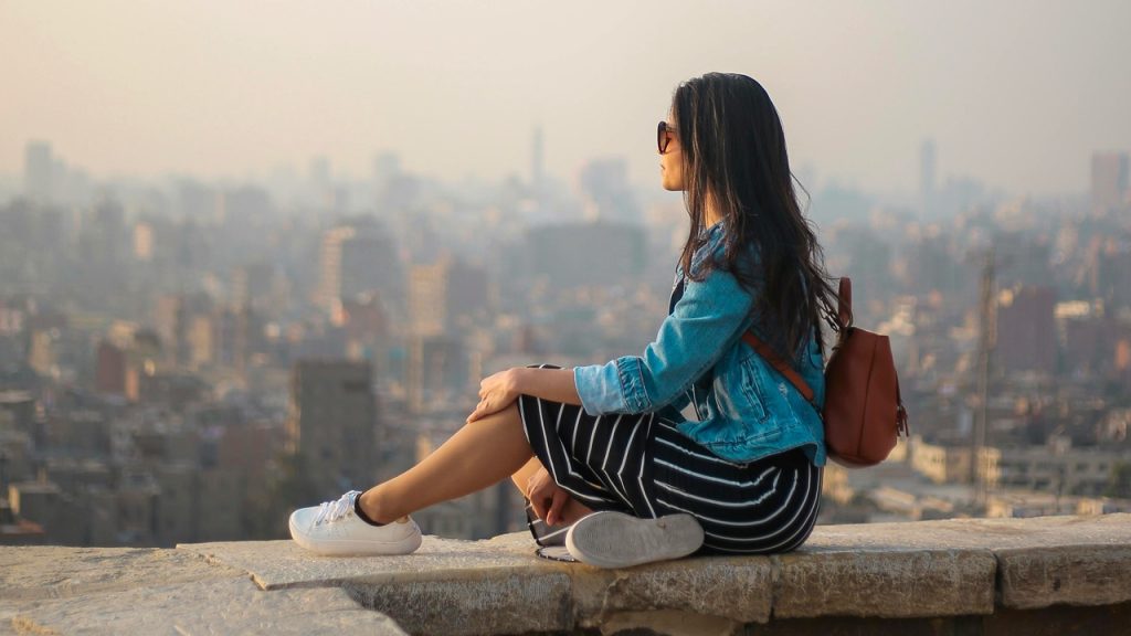 A woman on vacation relaxing and enjoying the view