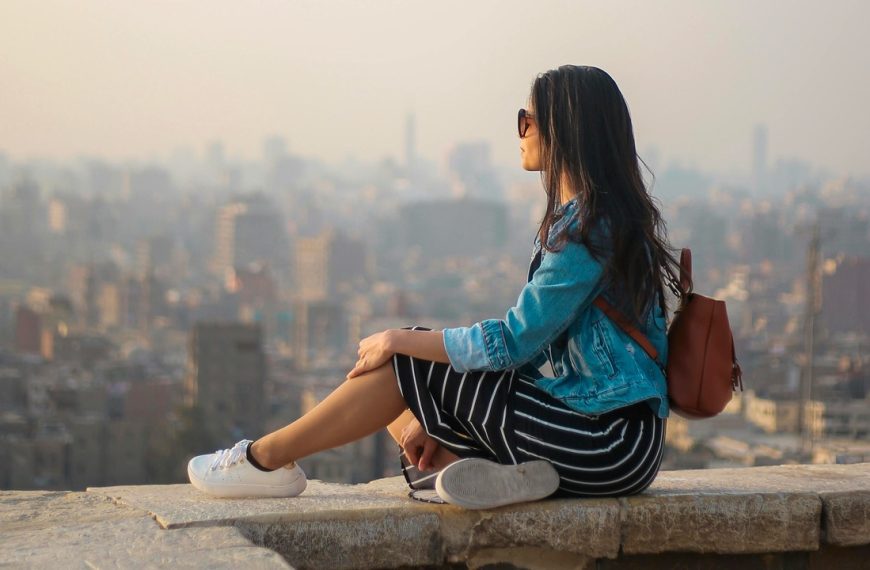 A woman on vacation relaxing and enjoying the view