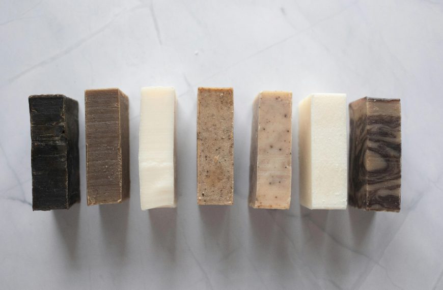 Collection of natural soaps placed on marble table
