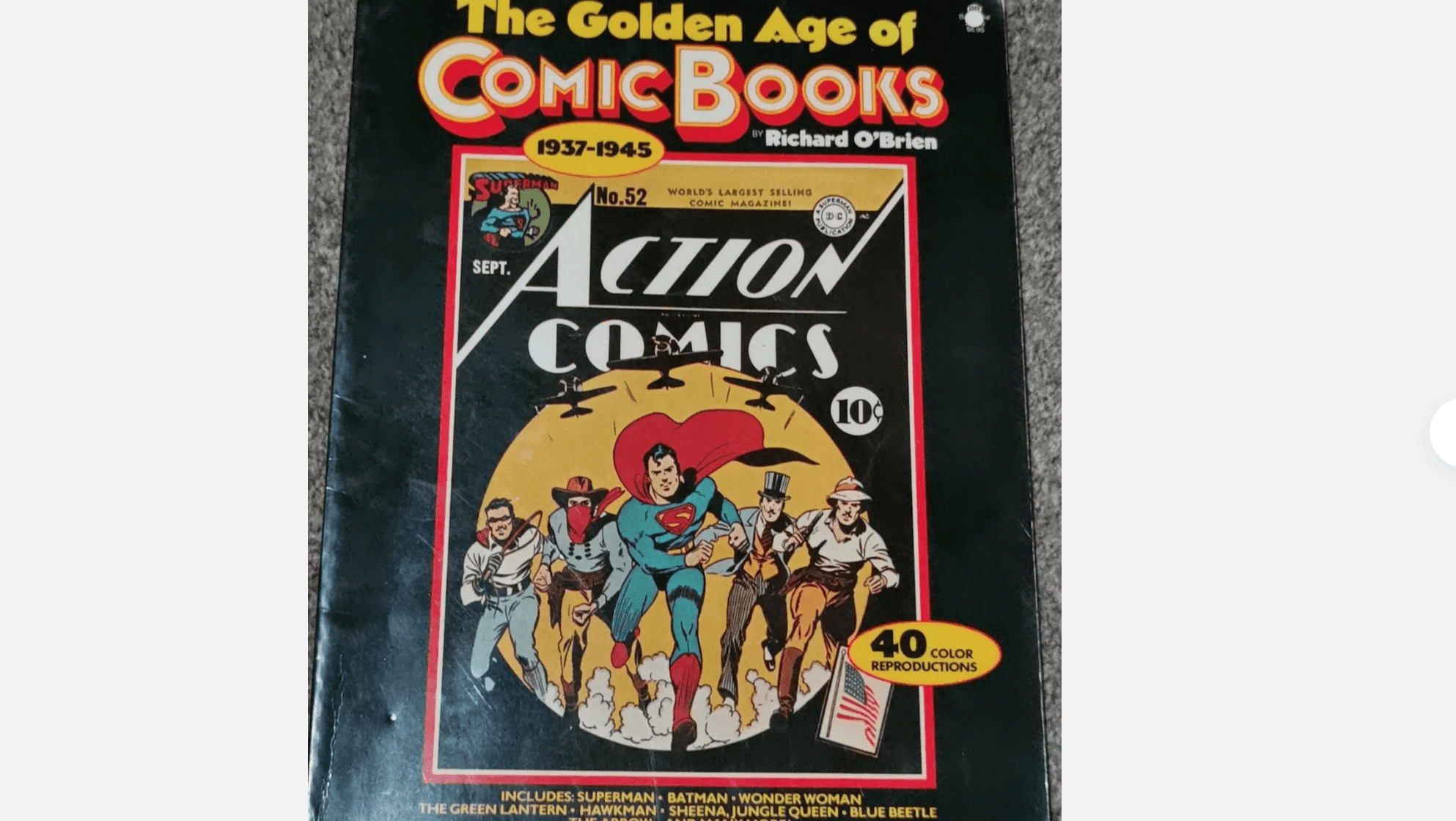 Cover of “The Golden Age of Comic Books” by Richard O’Brien, featuring Action Comics artwork, Superman in center, black background