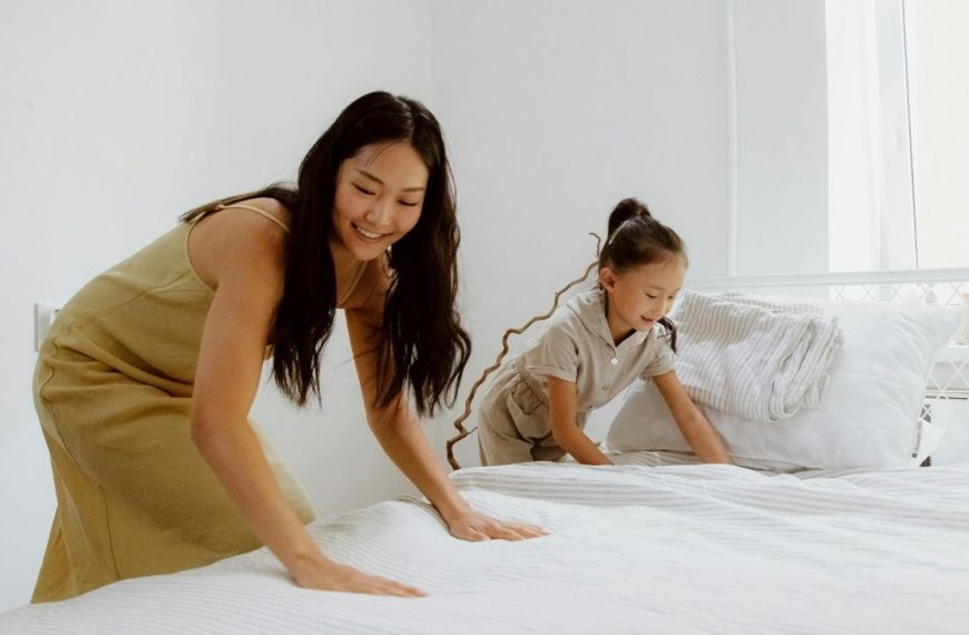 Mom and Daughter cleaning a mattress