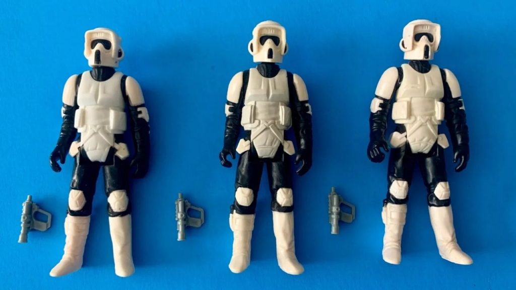 original Star Wars action figures, vintage 3.75-inch scale, detailed character outfits, plastic weapons, 1970s-1980s Kenner design, posed in row, worn paint