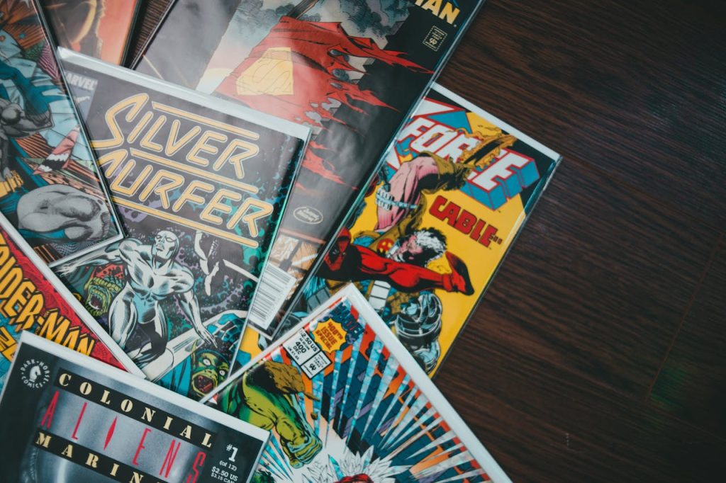 Stack of assorted vintage Marvel comic books, including Silver Surfer and Cable, placed on dark wooden surface, vibrant illustrated covers visible