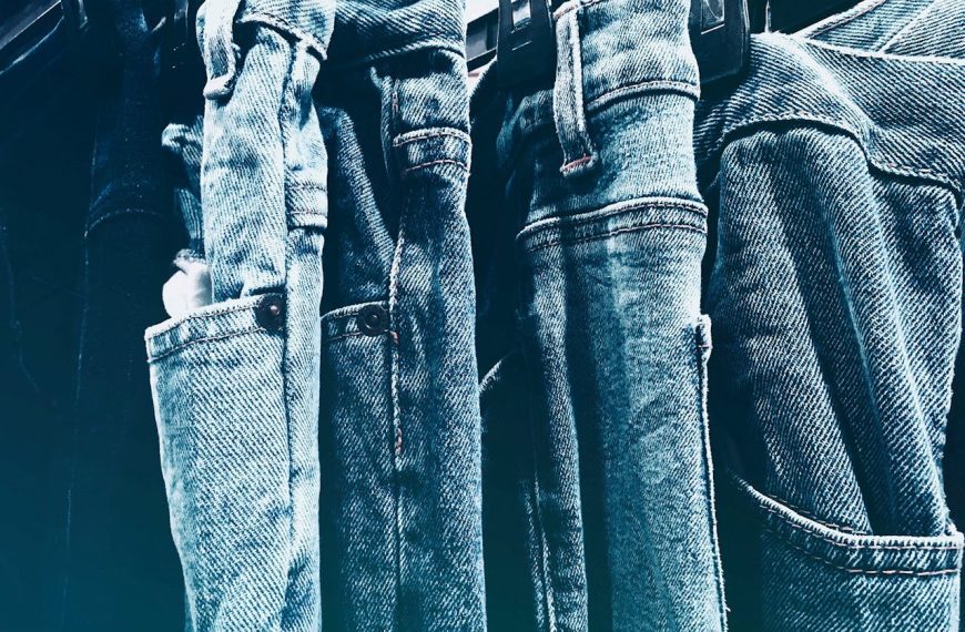 Stacked denim for retail display, fashion photoshoot backdrop, clothing store interior, vintage denim collection, second-hand clothing shop