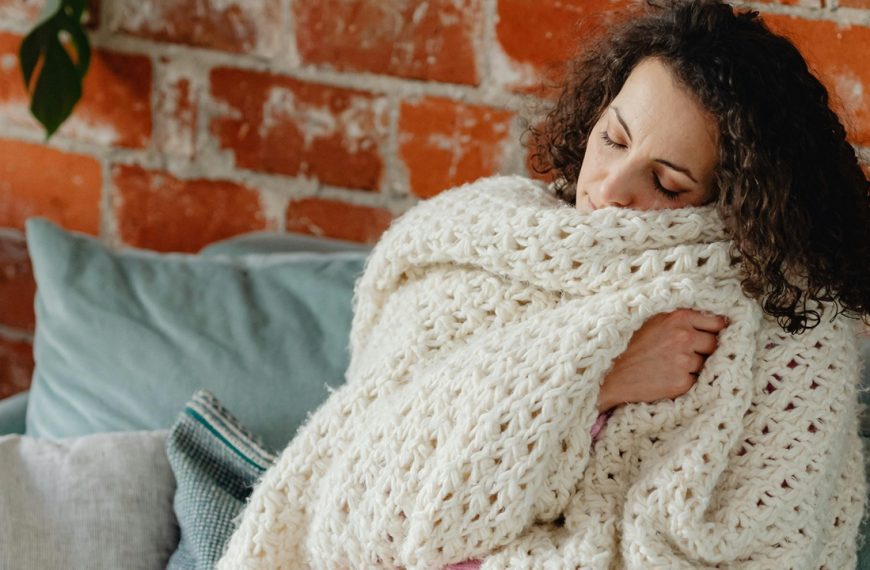 Woman with Blanket on Couch