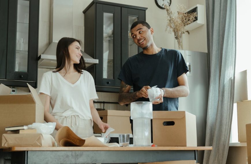 Man in Black Crew Neck T-shirt Standing Beside Woman in White Crew Neck T-shirt
