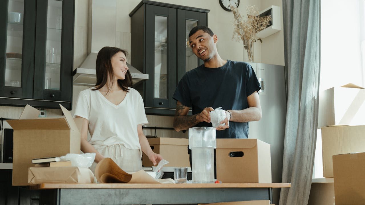 Man in Black Crew Neck T-shirt Standing Beside Woman in White Crew Neck T-shirt