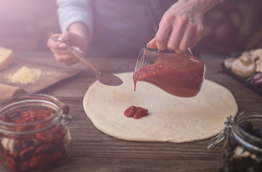 Preparing traditional Italian pizza.