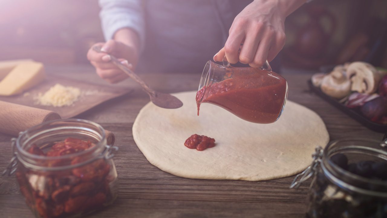 Preparing traditional Italian pizza.