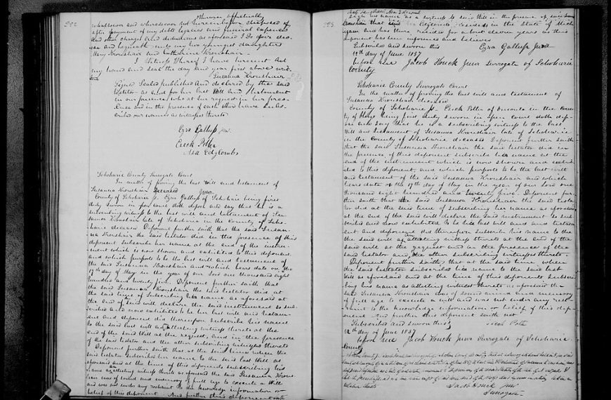 Open book with handwritten text on both pages, aged paper with visible ink markings, cursive writing in black ink, historical or archival document, possibly a journal or record book, photographed in black and white