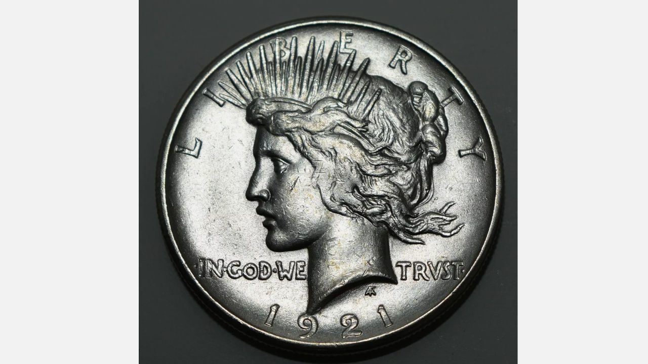 1921 Peace Silver Dollar, high-relief profile of Liberty with radiating crown, inscription “IN GOD WE TRVST,” date at bottom