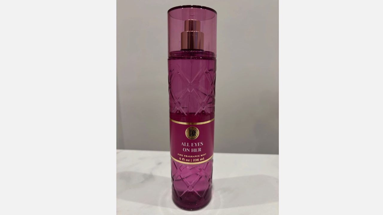 Purple diamond-patterned bottle of "All Eyes On Her" fine fragrance mist, 8 fl oz, with rose gold spray top