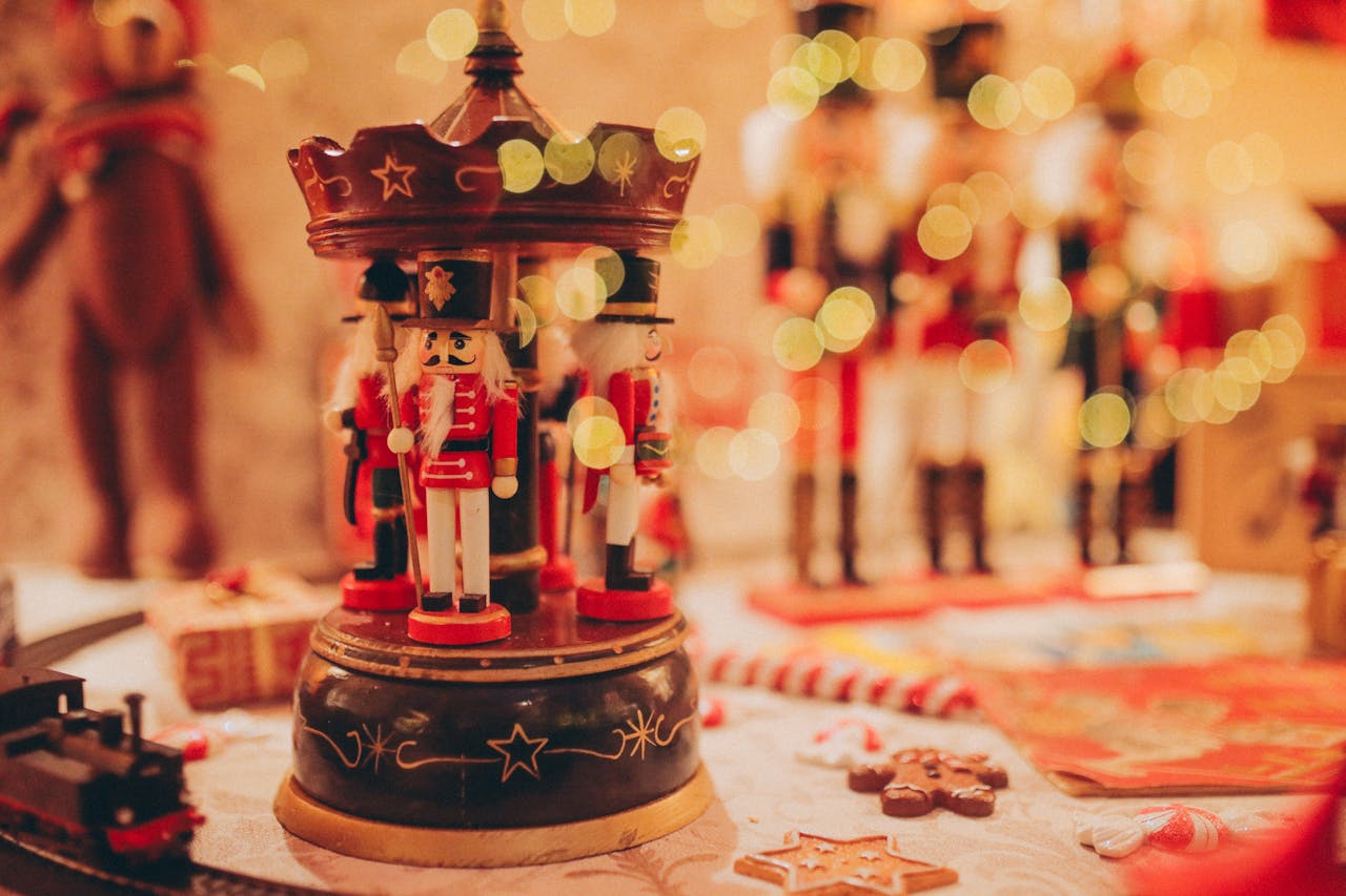 Nutcracker figurines on display, vibrant holiday decor, red and gold color theme, festive table setting