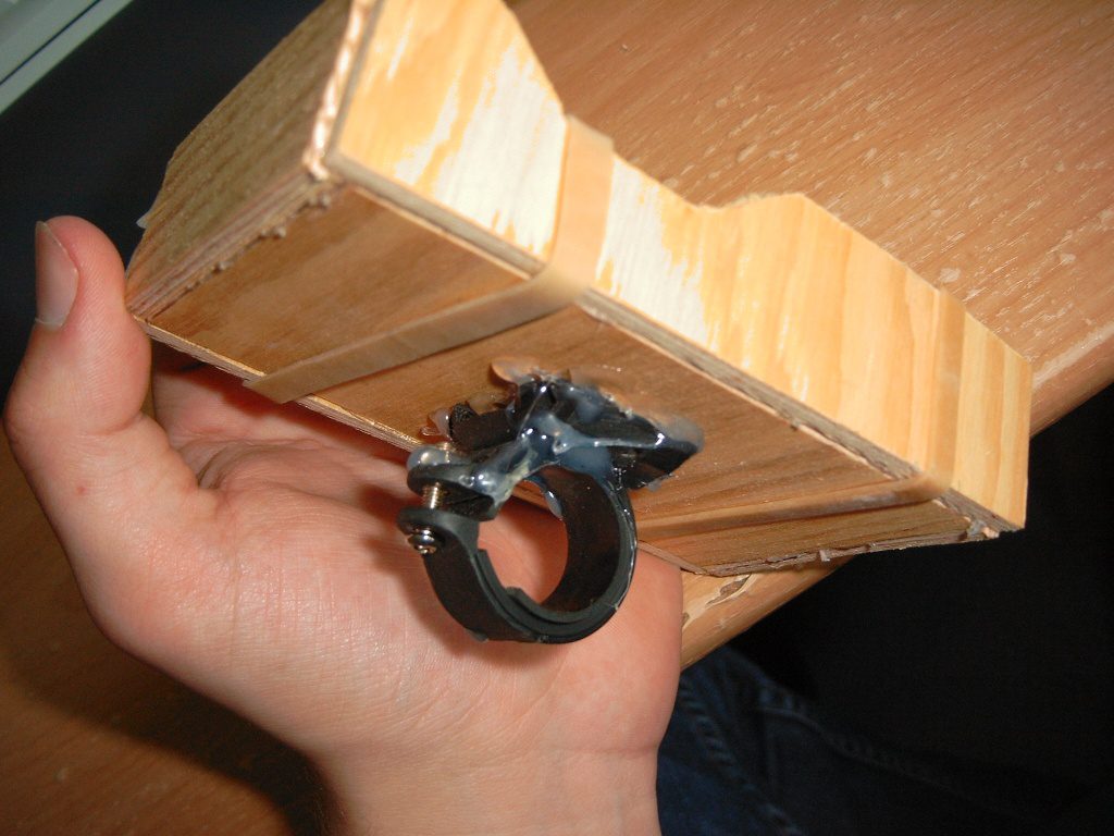 DIY bike accessory project, Custom GPS mount for bicycles, Homemade solution for bike-mounted electronics, Workshop craft using scrap wood, Test fitting a prototype device holder