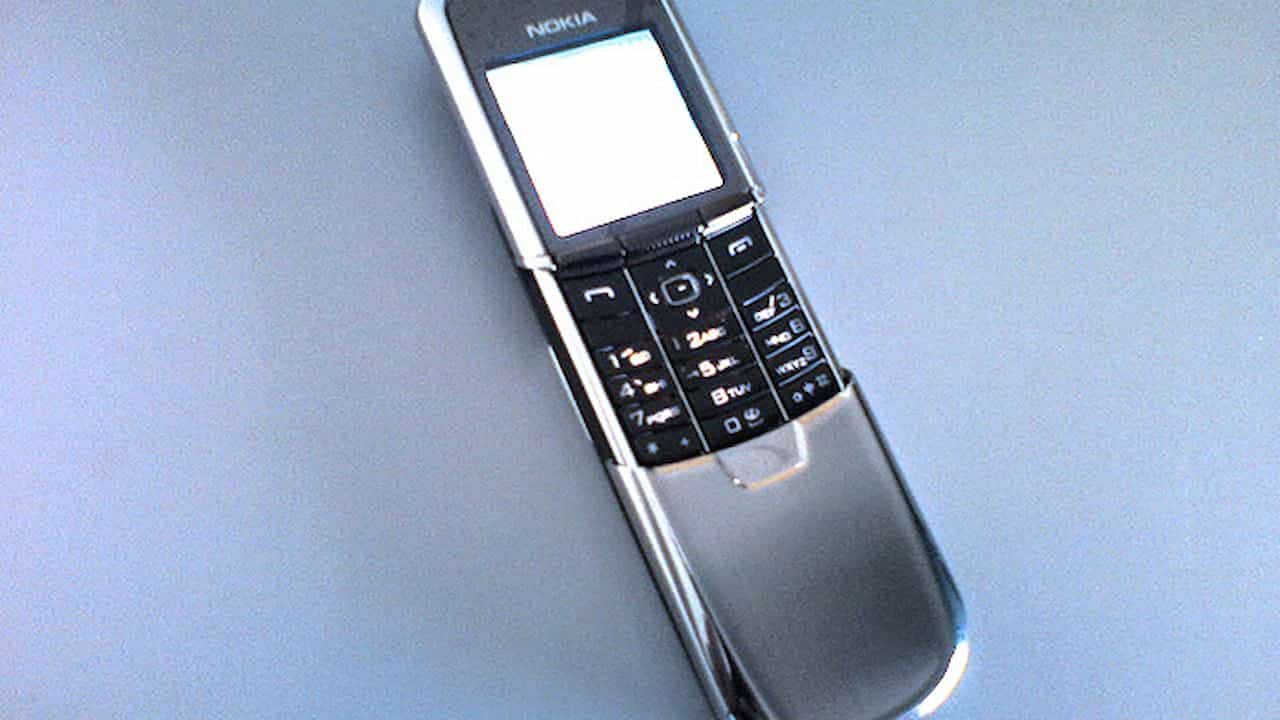 Nokia 8800, stainless steel finish, slider mobile phone, black keypad, monochrome screen, sleek and compact design