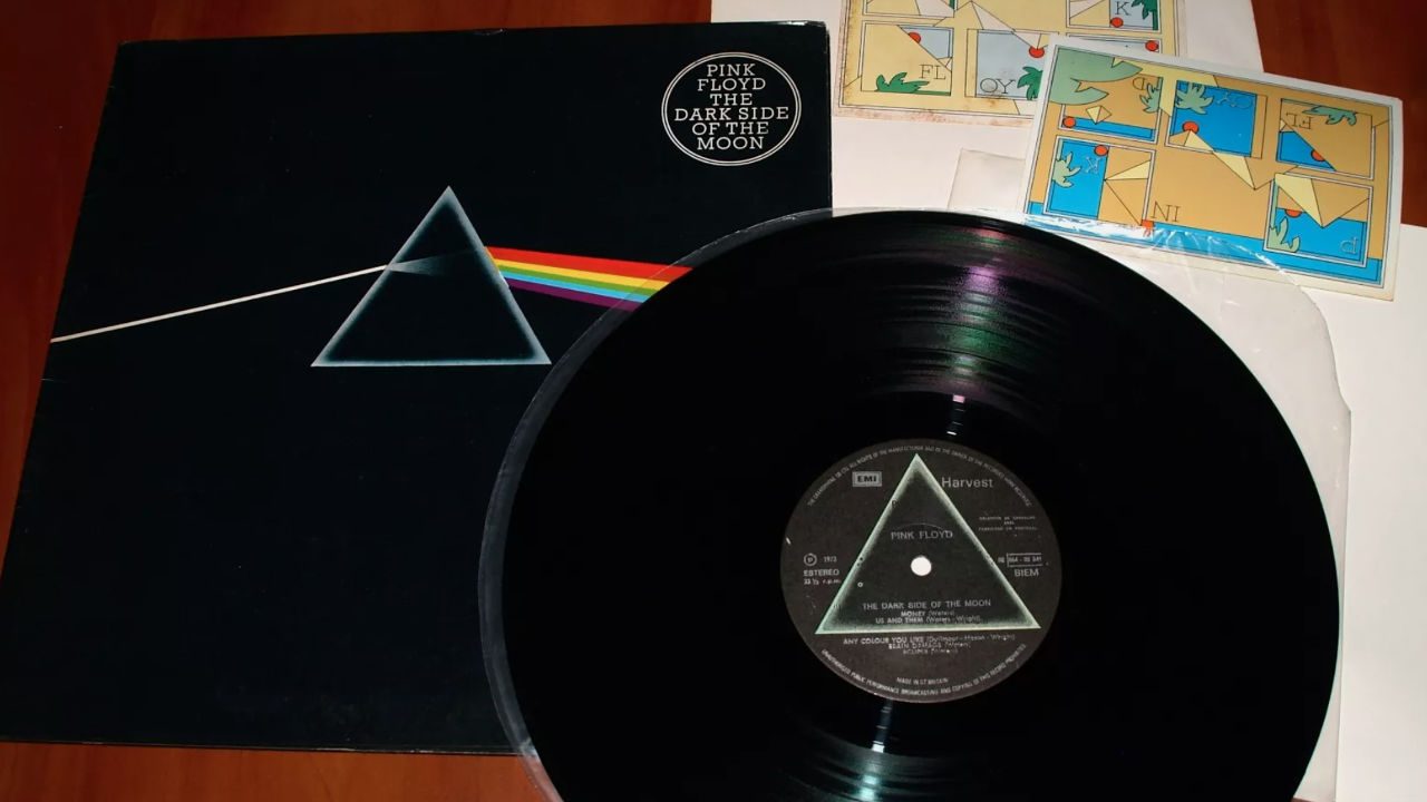 Pink Floyd "The Dark Side of the Moon" original UK pressing vinyl record, black cover with iconic prism and rainbow design
