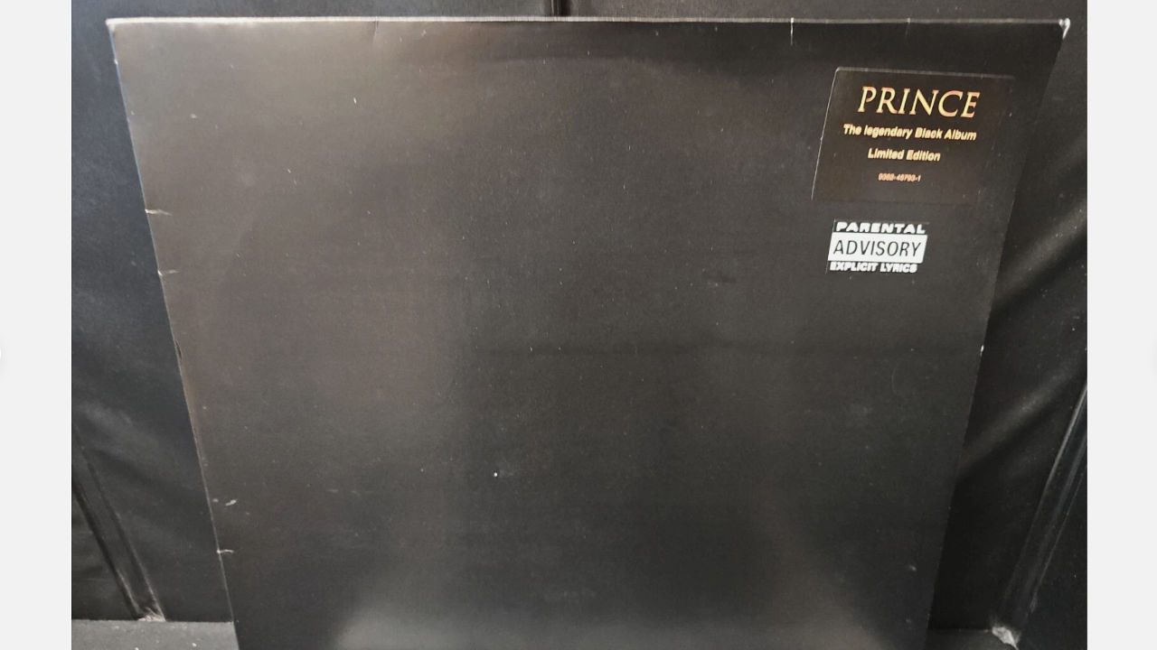 Plain black album cover with the text "PRINCE The legendary Black Album Limited Edition" and "PARENTAL ADVISORY EXPLICIT LYRICS" 