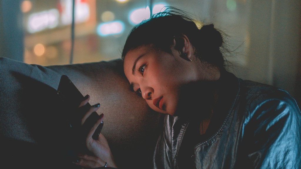 Sad woman cell phone