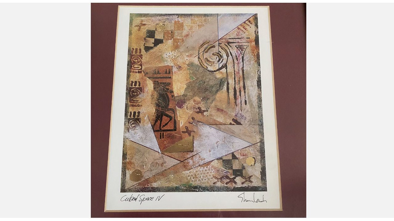 Framed abstract art print titled "Cubed Space IV" with earthy tones, geometric shapes, and tribal-inspired patterns