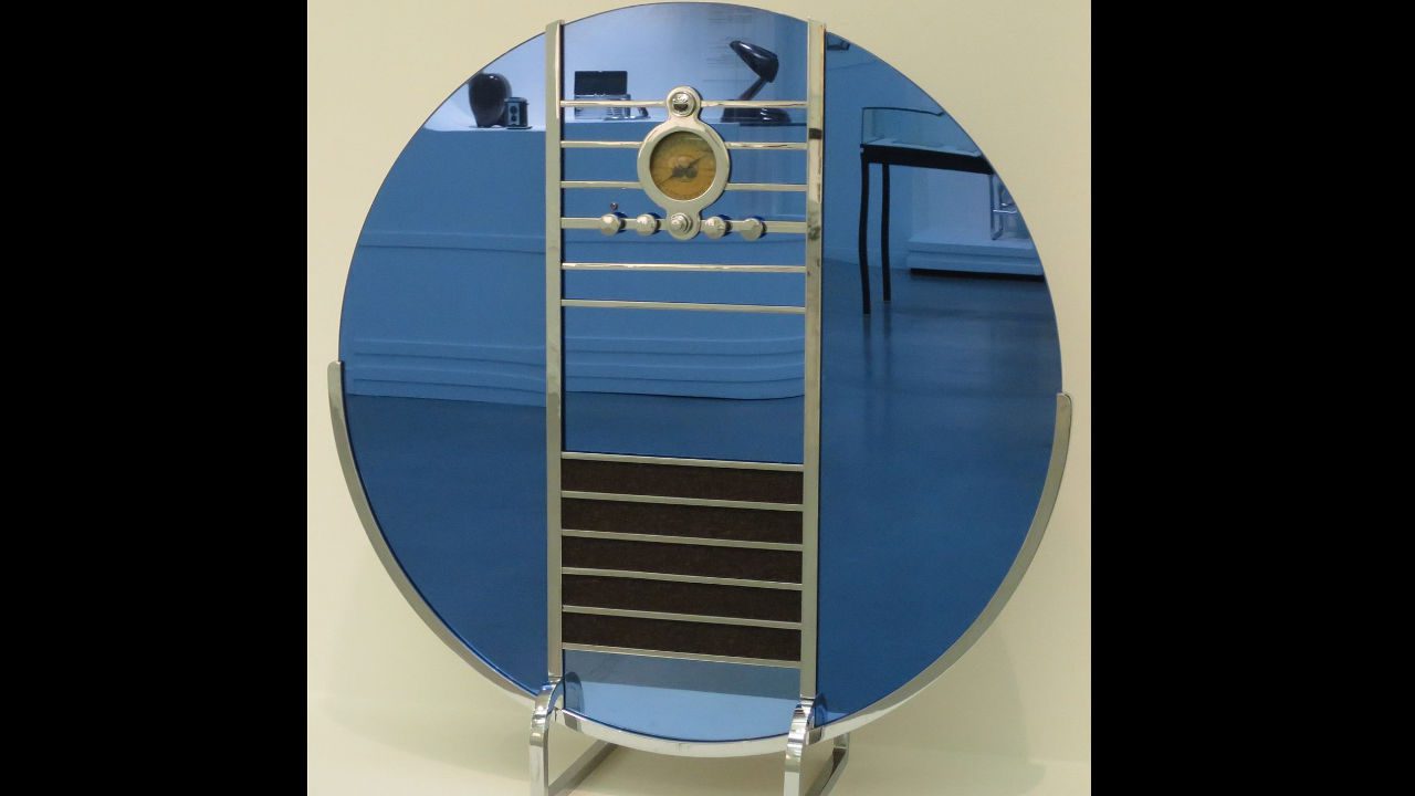 Sparton Nocturne vintage Art Deco radio with a circular mirrored glass front, chrome accents, central dial, and sleek horizontal grille design