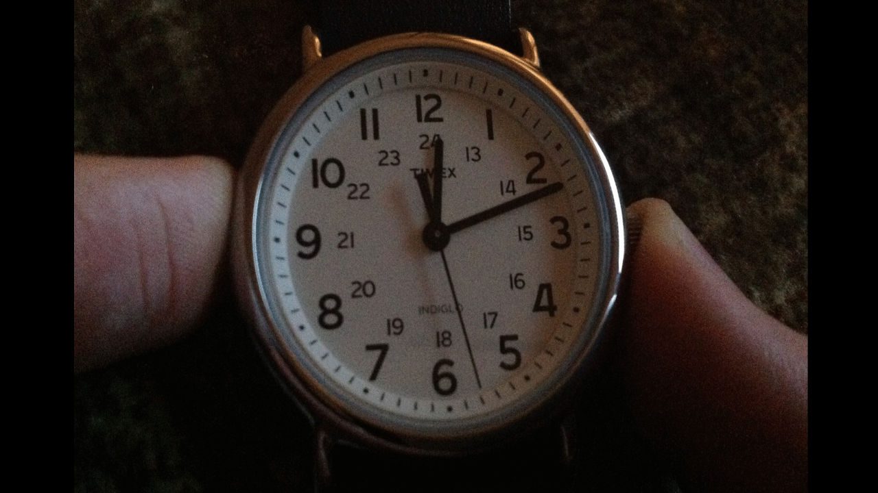 Timex Weekender analog wristwatch showing the time as 12:11:27