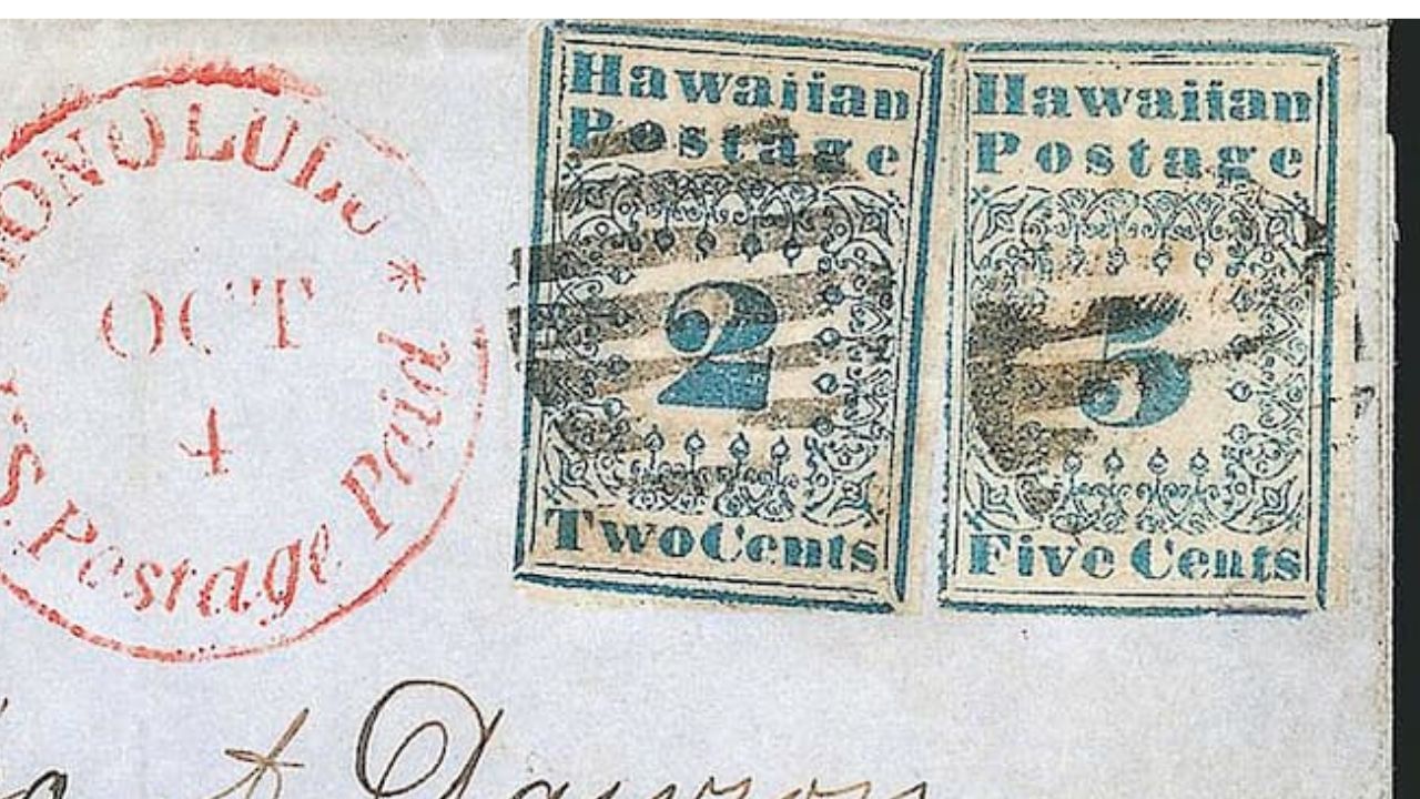 Vintage envelope with two Hawaiian Postage stamps, one blue 2 cents and one blue 5 cents, both with ornate designs and barred cancel marks, next to a red circular "HONOLULU OCT 4 U.S. Postage Paid" postmark on white paper