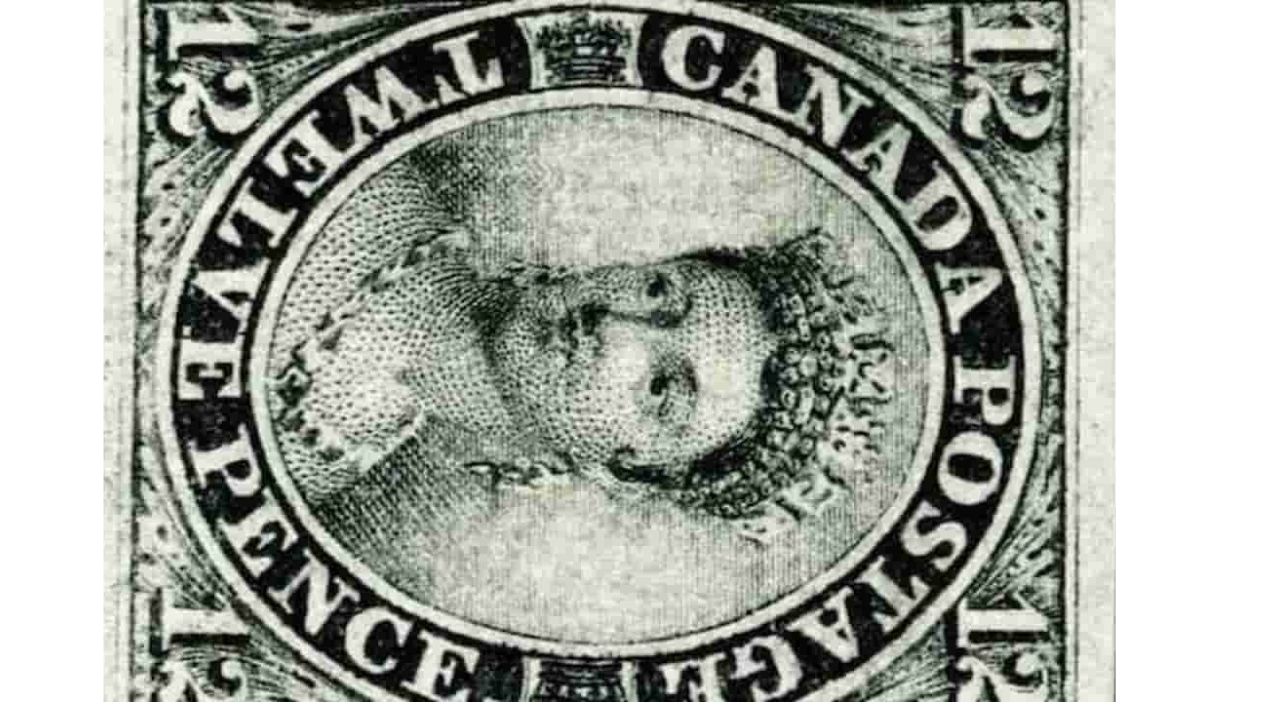 Rare Canadian postage stamp, 12 pence denomination, black and white, inverted image of Queen Victoria in the center, framed with bold serif lettering reading "CANADA POSTAGE" and "TWELVE PENCE," wide white margins