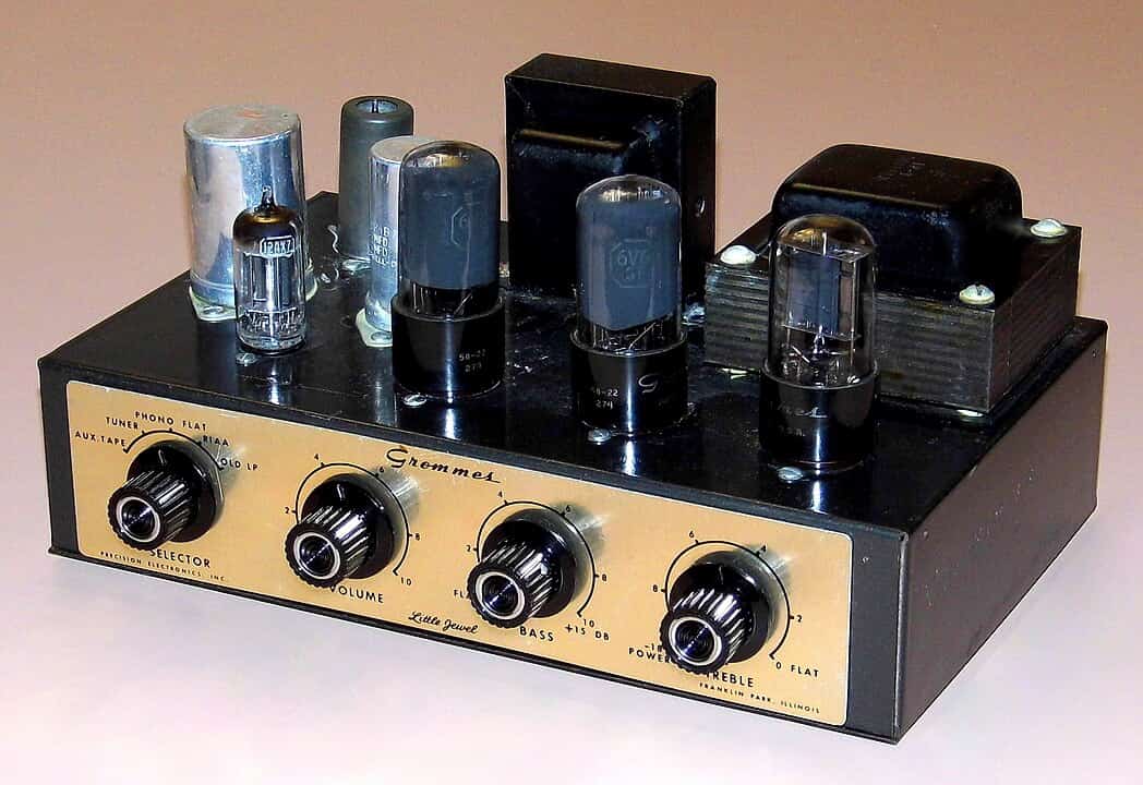 Vintage Grommes tube amplifier with exposed vacuum tubes, large control knobs for selector, volume, bass, and treble, labeled “Little Jewel” on the front panel