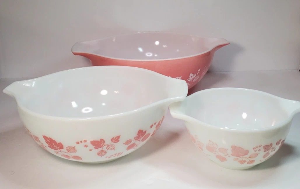 Three Vintage Pyrex Bowls in different colors on a white countertop