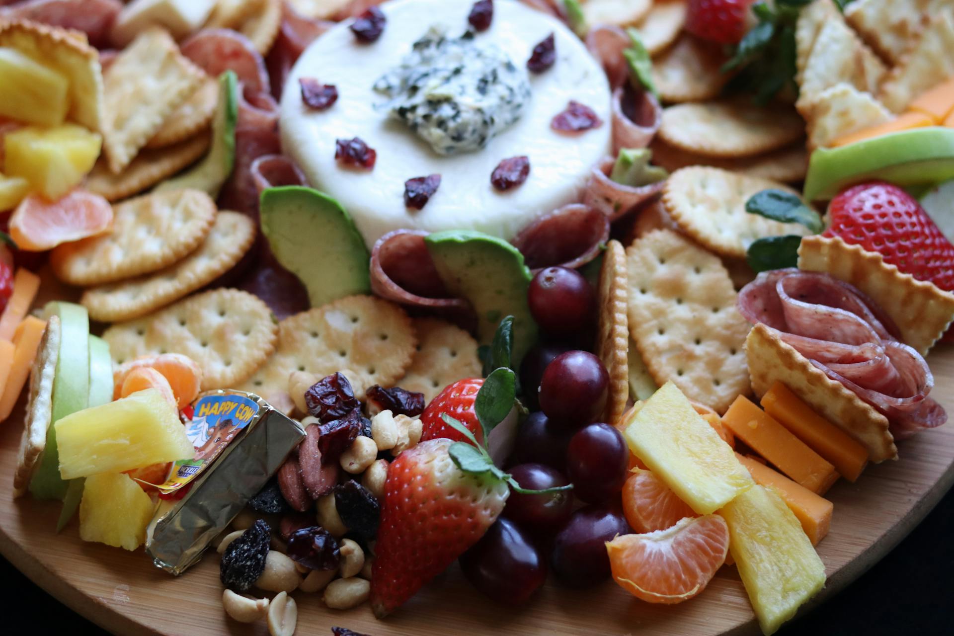 charcuterie board with assorted cheeses and crackers