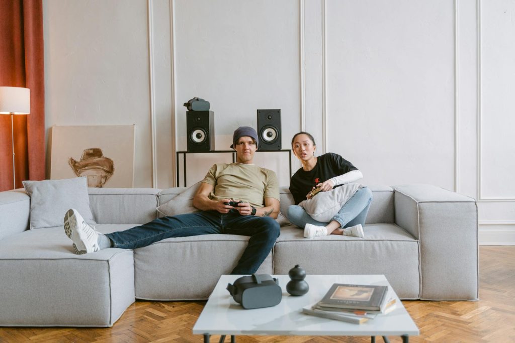 A Couple Paying Video Game in the Living Room