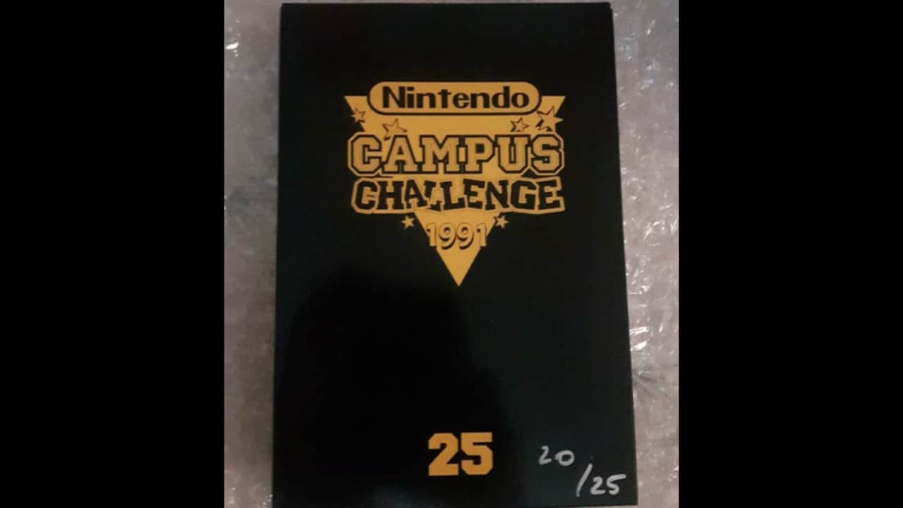 1990 Nintendo Campus Challenge NES cartridge, gray NES game with white label, official Nintendo branding, retro competition game, placed on flat surface