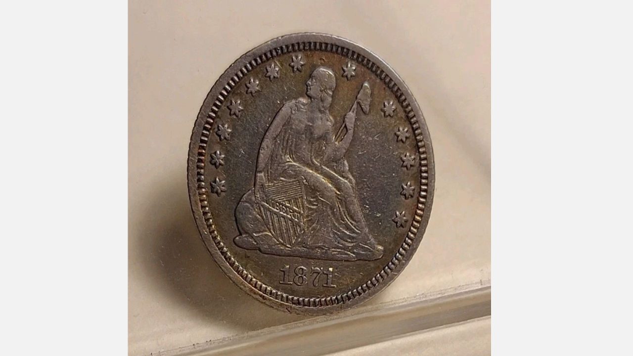 1871-CC Seated Liberty Quarter, Liberty holding shield and pole, surrounded by stars, “1871” at bottom