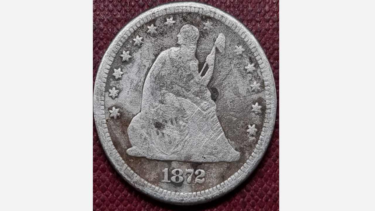 1872-S Seated Liberty Quarter, worn silver coin showing Liberty seated with stars around the edge