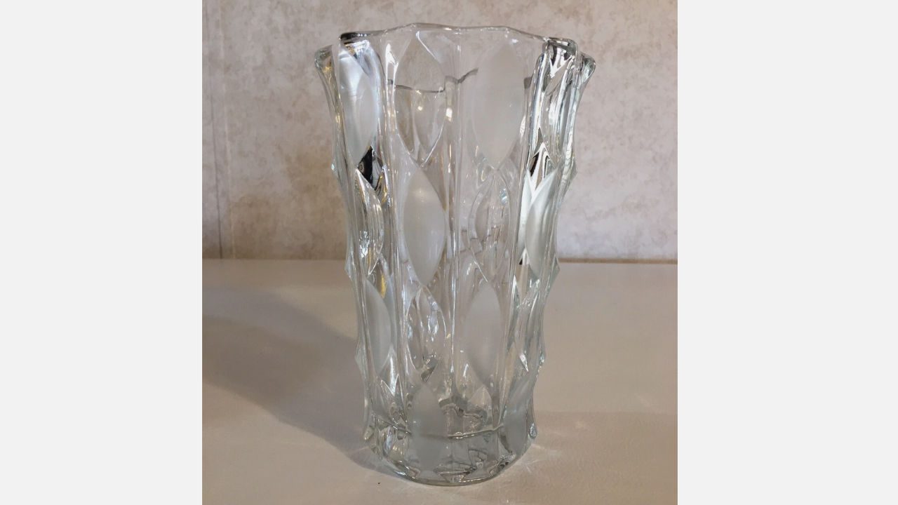 Vintage crystal vase with scalloped edges and leaf-patterned embossed design