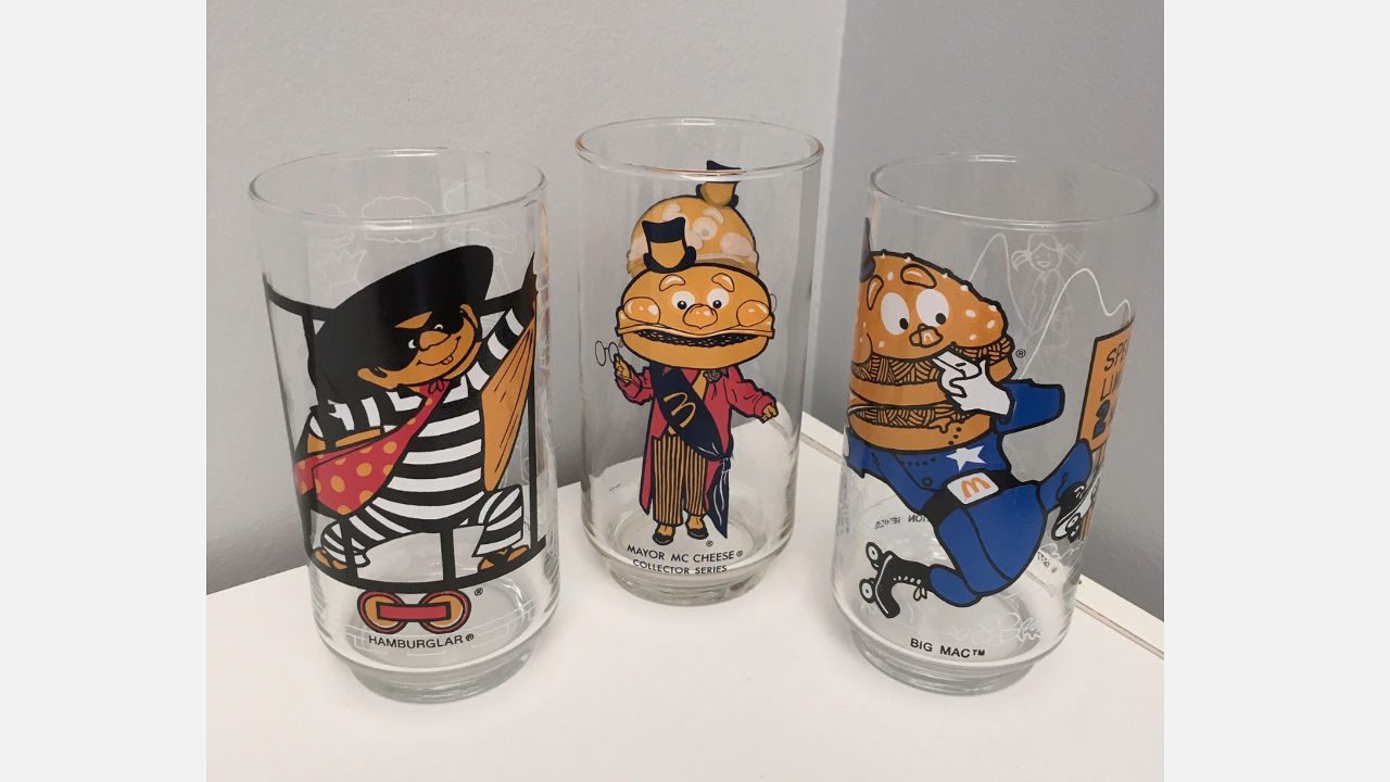 Three vintage McDonald’s character glasses featuring Hamburglar, Mayor McCheese, and Big Mac from the 1977 Collector Series
