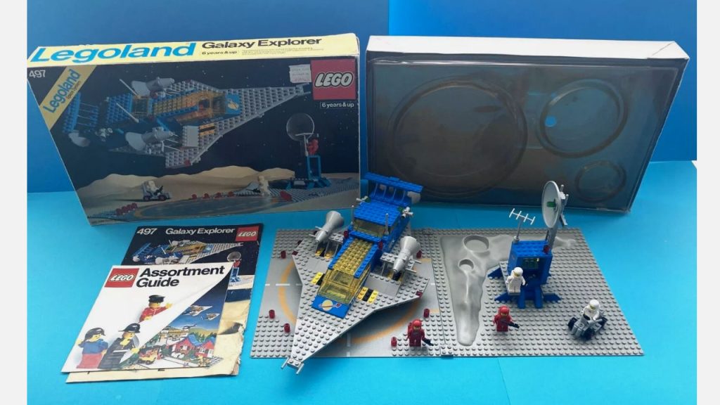 vintage 1980s LEGO Galaxy Explorer set with original box, manuals, space-themed baseplates, and assembled spacecraft