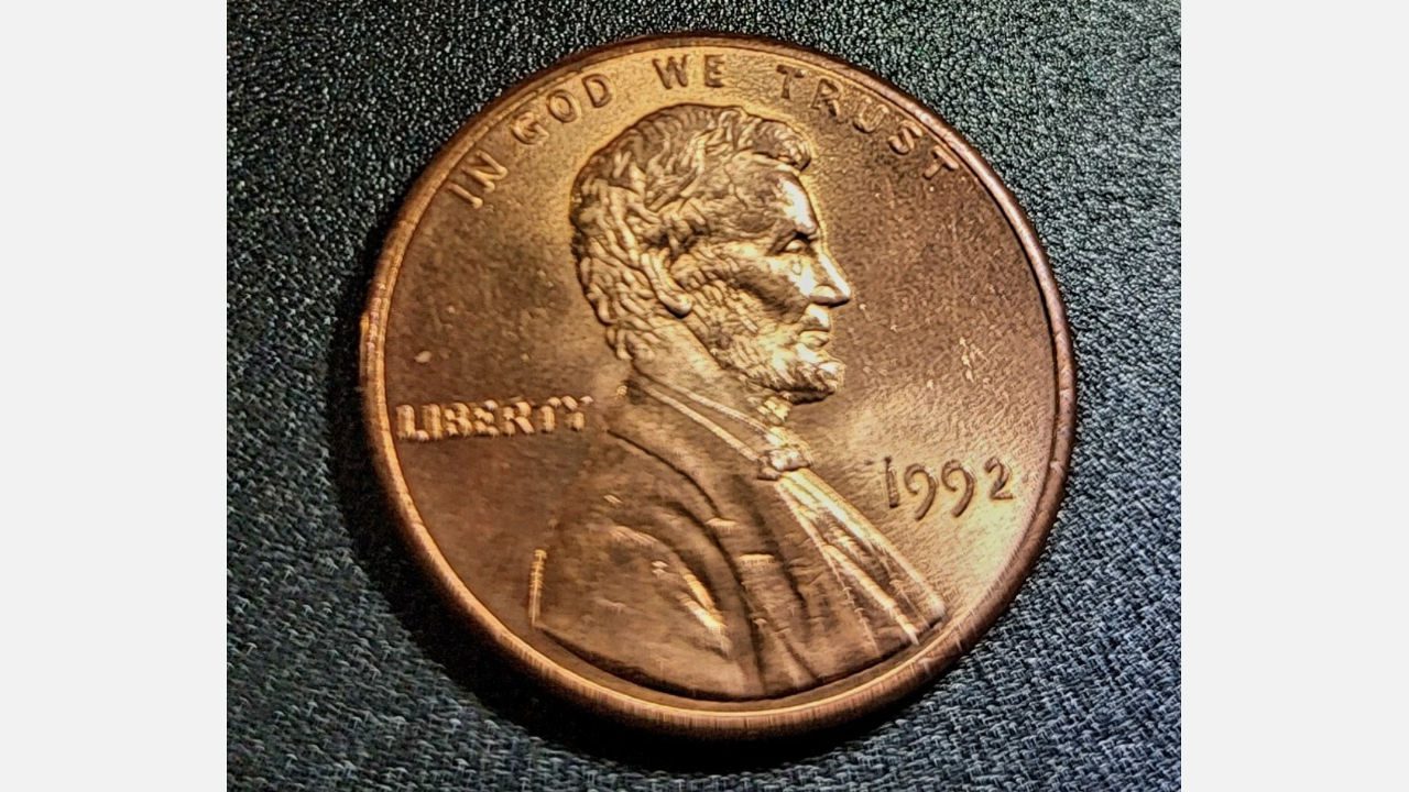 1992 Lincoln penny showing Abraham Lincoln profile with “IN GOD WE TRUST” and the year 1992