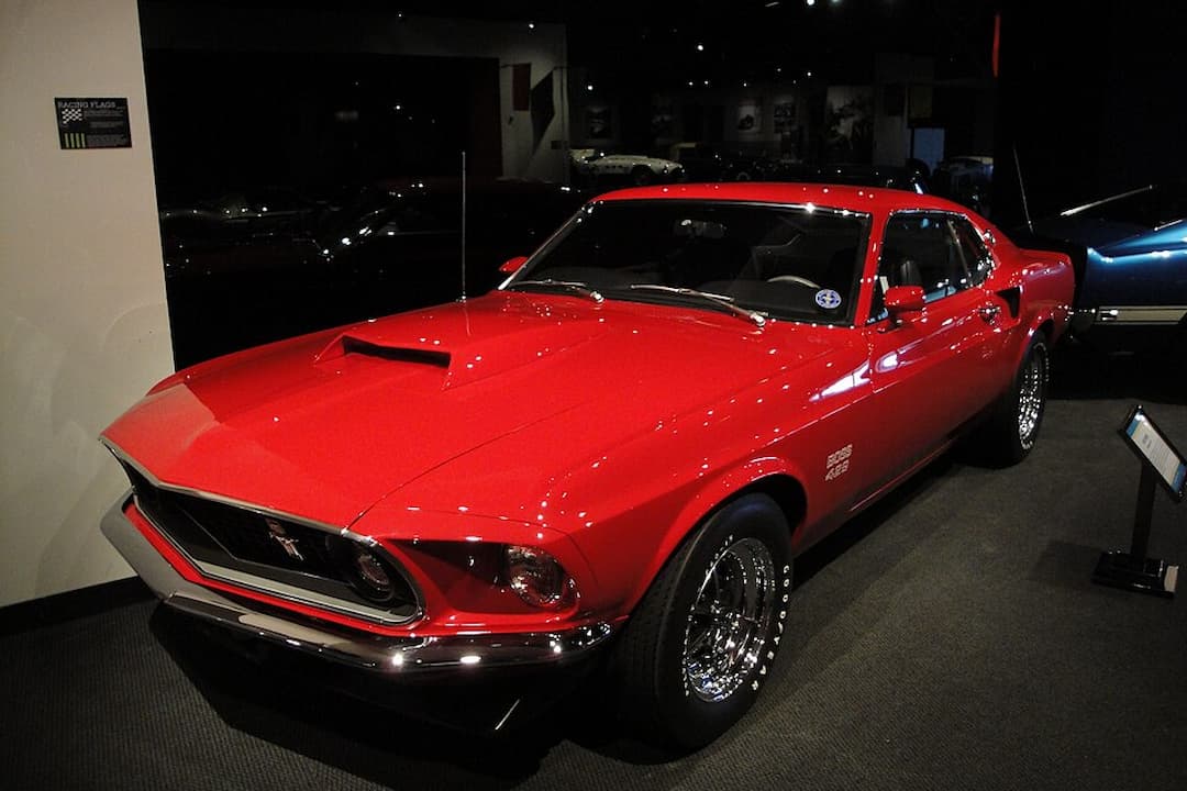 1970 Boss 429 Mustang, muscular body, aggressive hood scoop, fastback design, wide stance, chrome bumpers, front spoiler, iconic Boss 429 badging, classic American muscle styling