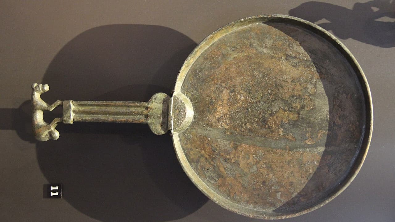 Old rusty pan, worn metal surface, rust spots, chipped edges, dull finish, circular shape, visible corrosion, aged appearance