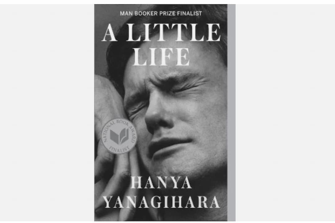 A Little Life by Hanya Yanagihara, paperback edition, black-and-white cover photo of a man’s anguished face, bold white title text, author’s name in uppercase, thick spine, published by Anchor Books