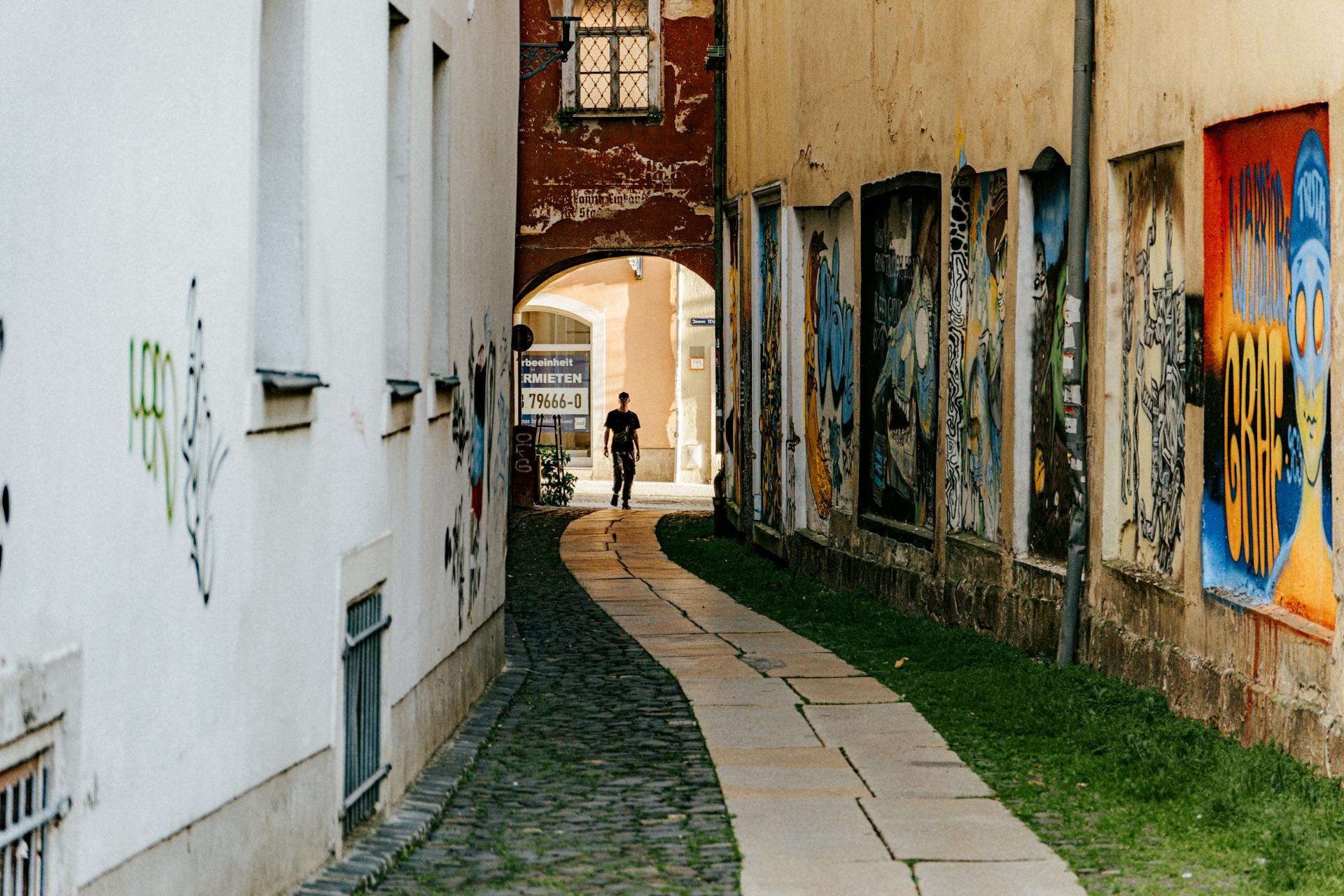 Narrow Alleyway with Vibrant Urban Graffiti