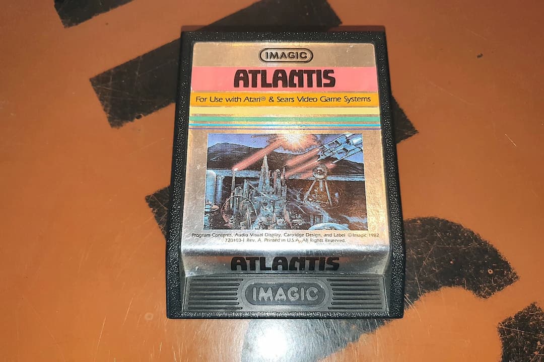 Atlantis II cartridge for Atari 2600, black plastic casing, white label with red text, retro video game, rare contest edition