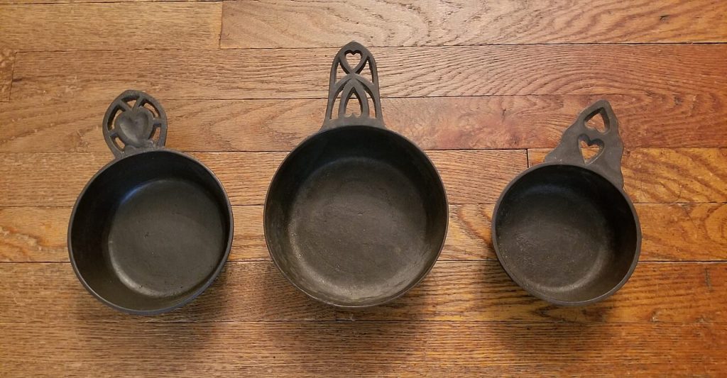 Cast Iron 19th Century American Porringers. Only the one on the right is marked. J. Savery