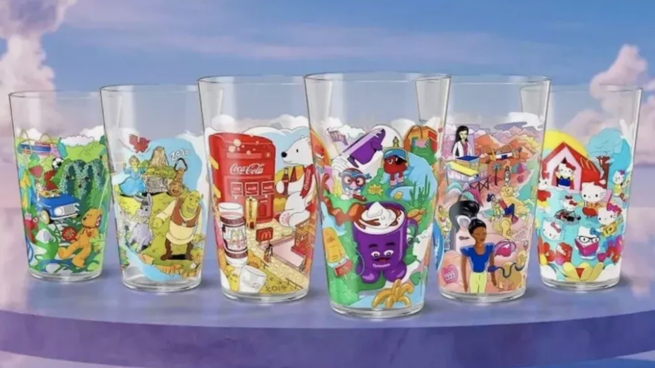 Set of six colorful 2024 McDonald's Collector’s Edition glasses featuring Shrek, Hello Kitty, Grimace, Coca-Cola bear, and various themed characters