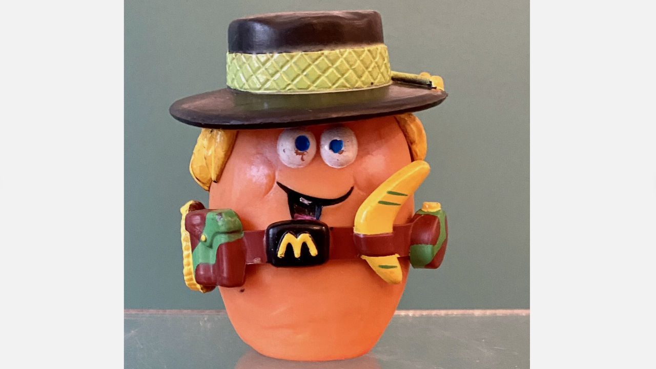 McDonald's Cowpoke McNugget Buddy toy from 1988 wearing a cowboy hat, banana holster, and western gear