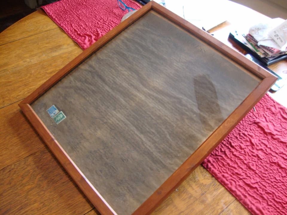 Declaration of Independence copy, aged parchment paper, cursive calligraphy, historical U.S. document, signatures at the bottom, official 18th-century script, preserved in a protective frame