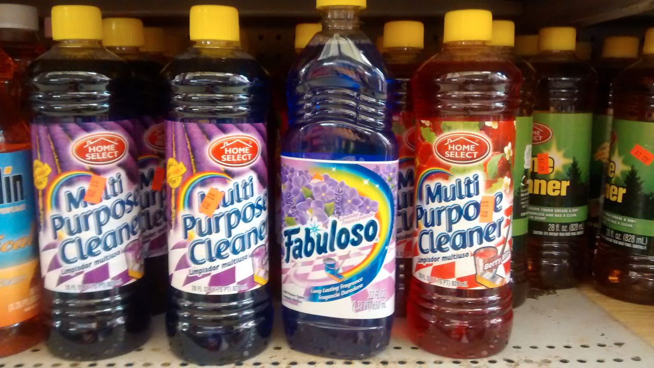 Bottles of Fabuloso and Home Select multi-purpose cleaners displayed on a store shelf