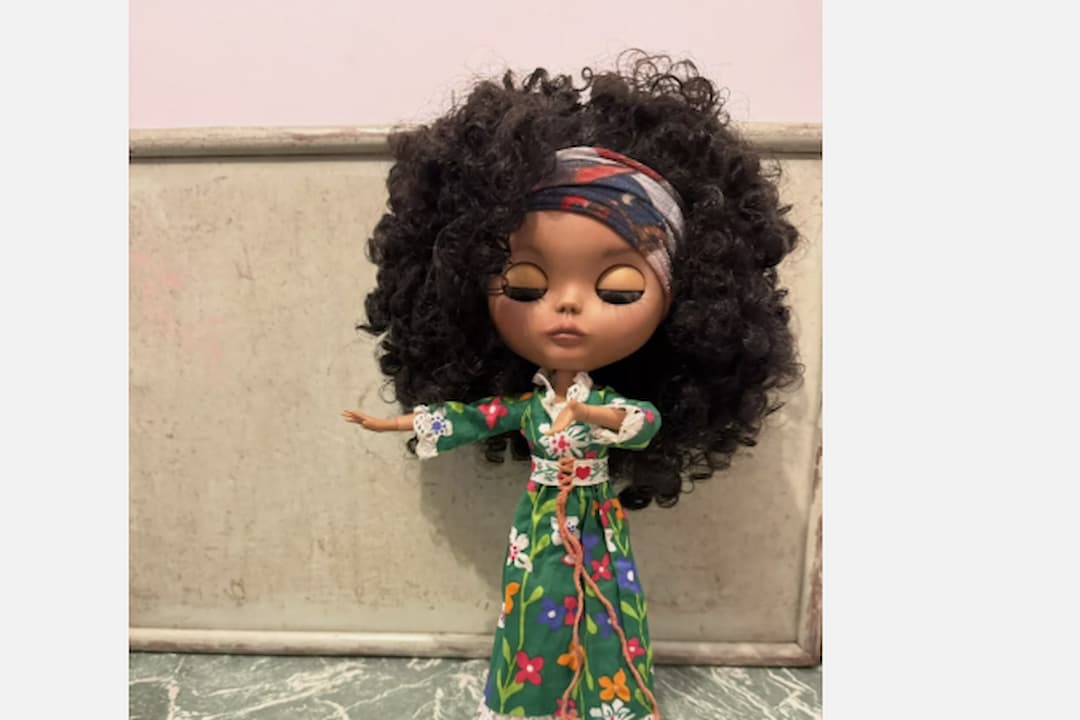 Kenner Blythe Dolls, large-headed fashion dolls, oversized eyes with color-changing gaze, vintage 1970s design, colorful retro clothing, plastic bodies, rooted hair in various shades, posed upright