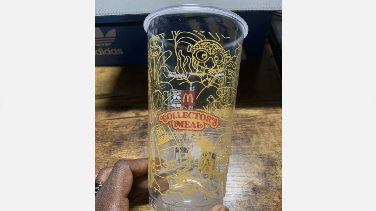 Limited edition McDonald's Collector's Meal plastic cup with yellow illustrations and retro design elements